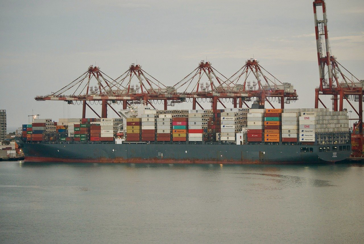 Photo of the docked Cargo ship, full of containers, in port